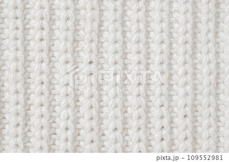 White knitted wool fabric texture background White knitted wool fabric texture background 109552981