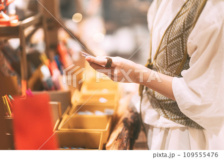 Asian woman choosing gift shop on Christmas and happy new year holidays 109555476