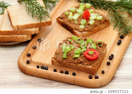 Pate spread from deer meat on whole grain bread and green onion Pate spread from deer meat on whole grain bread and green onion 109557121