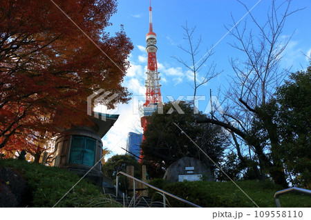 Tokyo Tower with the new Azabu Hills building as seen from Shiba Park in Tokyo Japan with a blue sky Tokyo Tower with the new Azabu Hills building as seen from Shiba Park in Tokyo Japan with a blue sky 109558110