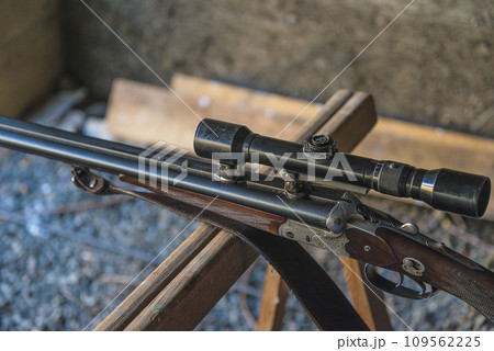 Close up for one rifle with optical sight Close up for one rifle with optical sight 109562225