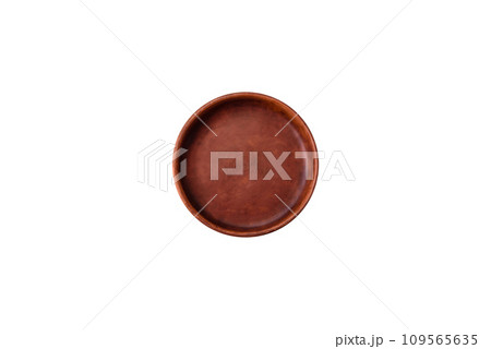 Bumpy empty ceramic plate on a textured concrete background 109565635