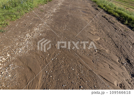 landslides on a country road after heavy rains and rains in summer 109566618