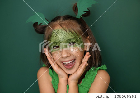 Enthusiastic girl with dragon makeup rejoices at the arrival of new year 2024 Enthusiastic girl with dragon makeup rejoices at the arrival of new year 2024 109566861