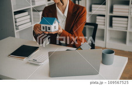 Young friendly operator woman agent with headsets working in a call centre. Young friendly operator woman agent with headsets working in a call centre. 109567525