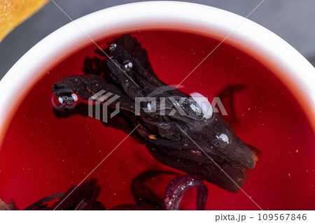 delicious red tea from rose buds on the table 109567846