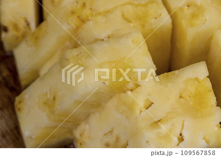 Sliced pieces of ripe yellow pineapple Sliced pieces of ripe yellow pineapple 109567858
