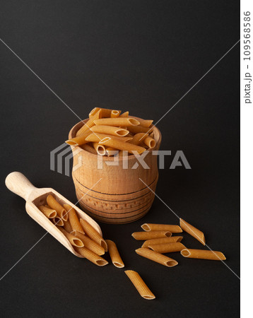 Raw Brown Pasta, Wholegrain Penne, Dry Whole Grain Noodle, Raw Spelt Macaroni, Healthy Italy Food 109568586