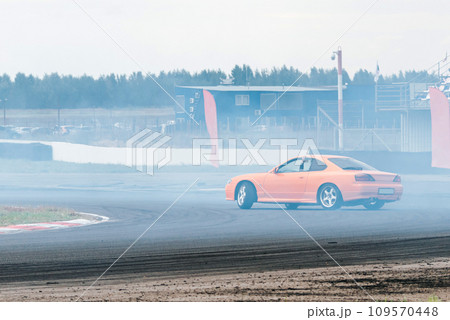 racing car in a skid. drift, tire smoke. sports car. extreme sport racing car in a skid. drift, tire smoke. sports car. extreme sport 109570448
