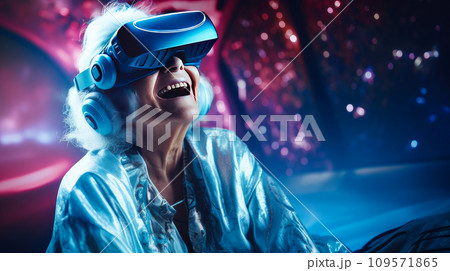 Portrait of a happy smiling enthusiastic Caucasian elderly old, gray-haired senior woman in a virtual reality headset. 109571865