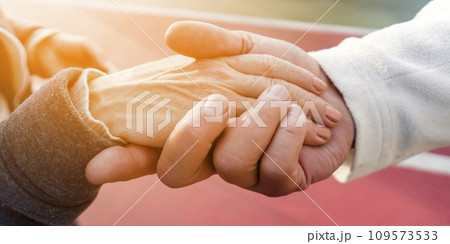 Hands together, man and a woman take care of each other. 109573533