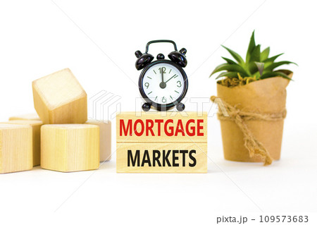 Mortgage markets symbol. Concept words Mortgage markets on beautiful wooden blocks. Beautiful white table white background. Black alarm clock. Business mortgage markets concept. Copy space. Mortgage markets symbol. Concept words Mortgage markets on beautiful wooden blocks. Beautiful white table white background. Black alarm clock. Business mortgage markets concept. Copy space. 109573683
