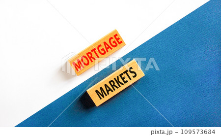 Mortgage markets symbol. Concept words Mortgage markets on beautiful wooden blocks. Beautiful white and blue background. Business mortgage markets concept. Copy space. 109573684
