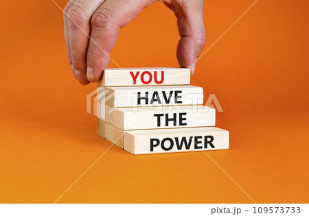 You have the power symbol. Concept word You have the power on beautiful wooden block. Beautiful orange background. Businessman hand. Business motivational you have the power concept. Copy space. 109573733