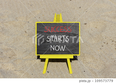Success starts now symbol. Concept word Success starts now on beautiful black blackboard. Sand beach. Beautiful sand beach background. Business motivational success starts now concept. Copy space. 109573779