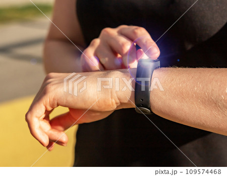 Using smart watch on hand closeup Using smart watch on hand closeup 109574468