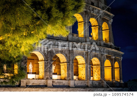 Amazing colosseum stadium exterior illuminated at night 109574574