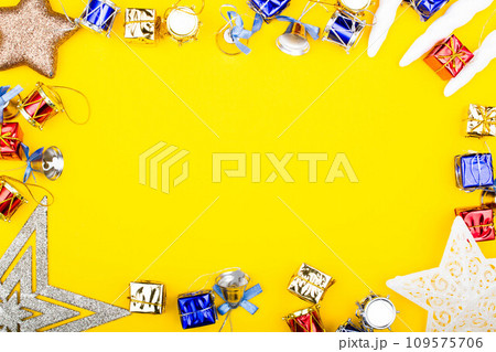 Christmas background. New Year banner Template with gift boxes, stars, bells, toys, decorations. Bright Christmas frame. Copy space. Winter holidays New Year. Top view photo for message or advertising Christmas background. New Year banner Template with gift boxes, stars, bells, toys, decorations. Bright Christmas frame. Copy space. Winter holidays New Year. Top view photo for message or advertising 109575706