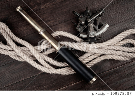 Retro vintage spyglass telescope with sextant Retro vintage spyglass telescope with sextant 109578387