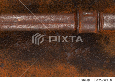 Rusty plumb tube on rusty metal wall Rusty plumb tube on rusty metal wall 109578416