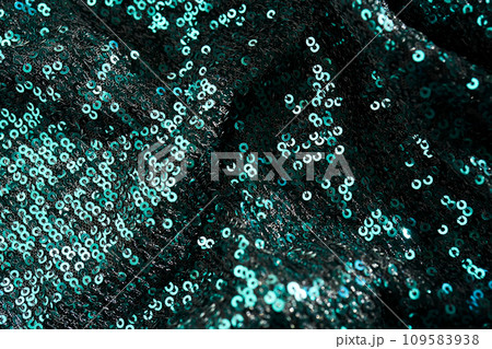 Christmas abstract background made of emerald green sequins. Christmas abstract background made of emerald green sequins. 109583938