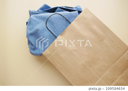 top view of craft paper bag with shirt , top view of craft paper bag with shirt , 109584634