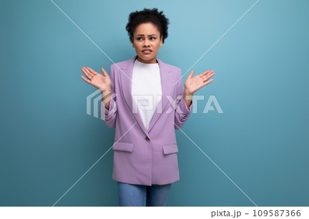 young successful hispanic brunette leader woman with curly hair dressed in a business suit young successful hispanic brunette leader woman with curly hair dressed in a business suit 109587366