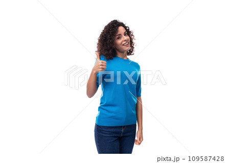 portrait of a young confident woman in a blue sweater with short sleeves on a white background portrait of a young confident woman in a blue sweater with short sleeves on a white background 109587428