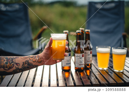 Beer on the table and camping party,hands toasting in beer, 109588888