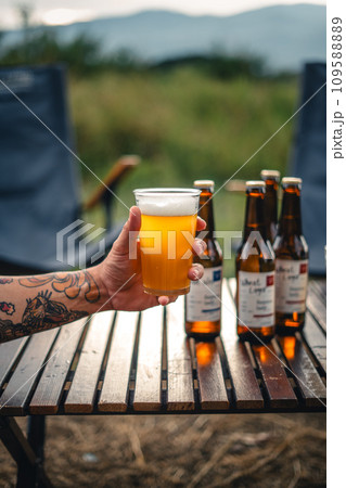Beer on the table and camping party,hands toasting in beer, 109588889