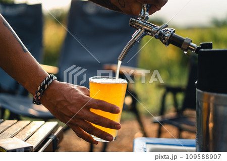 Beer on the table and camping party,hands toasting in beer, 109588907
