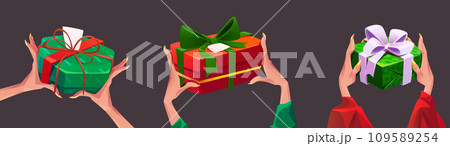 Women hands hold wrapped gift boxes 109589254