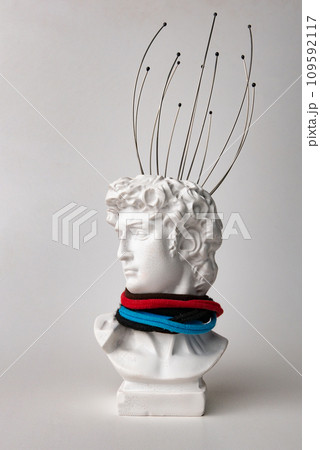 Antique male David statue's head with manual Massager for head isolated on a white background. 3d trendy cretive collage in magazine style. 3d contemporary art. Modern design Antique male David statue's head with manual Massager for head isolated on a white background. 3d trendy cretive collage in magazine style. 3d contemporary art. Modern design 109592117