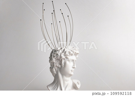 Antique male David statue's head with manual Massager for head isolated on a white background. 3d trendy cretive collage in magazine style. 3d contemporary art. Modern design Antique male David statue's head with manual Massager for head isolated on a white background. 3d trendy cretive collage in magazine style. 3d contemporary art. Modern design 109592118