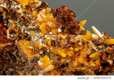 macro mineral Wulfenite stone on a black background macro mineral Wulfenite stone on a black background 109595475