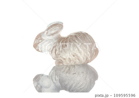 beautiful figurine of a hare made of topaz on a white background 109595596