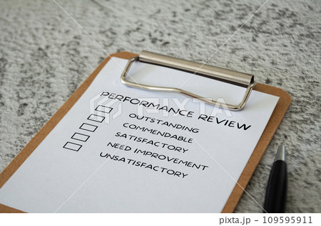 Performance Review checklist on clip board with pen. Performance review concept. Performance Review checklist on clip board with pen. Performance review concept. 109595911