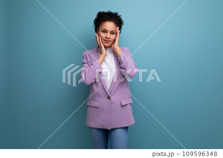 young brunette latin secretary woman dressed in purple jacket on studio background with copy space young brunette latin secretary woman dressed in purple jacket on studio background with copy space 109596348