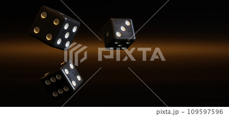 A bunch of thrown dices in warm light against dark background 109597596