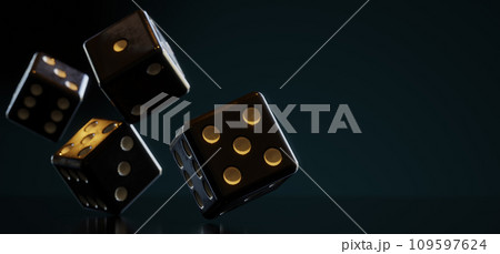 A bunch of thrown dices rolling on the table against dark background 109597624