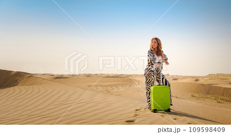 Concept and idea of travel to United Arab Emirates, sand dunes in desert of Dubai at sunset. 109598409