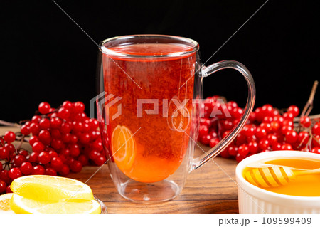 Vitamin berry viburnum tea with honey and lemon Vitamin berry viburnum tea with honey and lemon 109599409