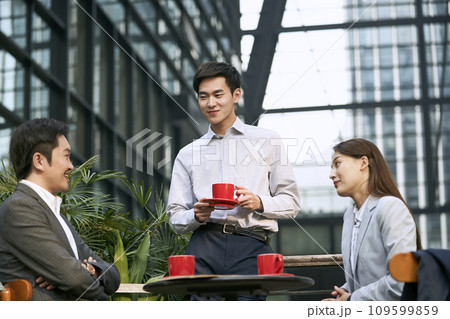 asian business people meeting in outdoor cafe asian business people meeting in outdoor cafe 109599859