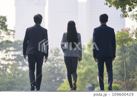 young asian business people walking on street young asian business people walking on street 109600429