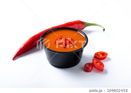Spicy chili sauce in a bowl isolated on white background Spicy chili sauce in a bowl isolated on white background 109602458