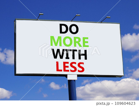 Do more with less symbol. Concept word Do more with less on beautiful big white billboard. Beautiful blue sky cloud background. Business do more with less concept. Copy space. 109604623