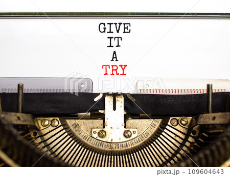 Give it a try symbol. Concept word Give it a try typed on beautiful old retro typewriter. Beautiful white paper background. Business give it a try concept. Copy space. 109604643