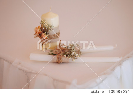 Candle with flowers on white background 109605054