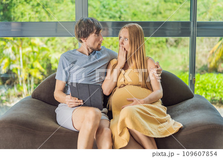 Cost of Pregnancy And Family Budgeting Concept. Young couple expecting baby, planning budget and counting spends at home 109607854
