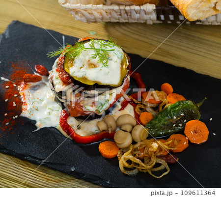 Fried eggplant and tomato pyramid 109611364